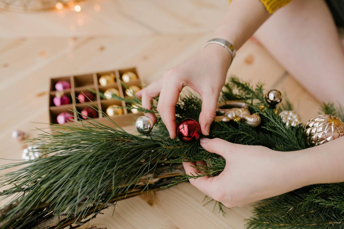 Before and after: Dollar store items transformed into elegant Christmas centerpiece with paint, ribbon, and natural pinecones