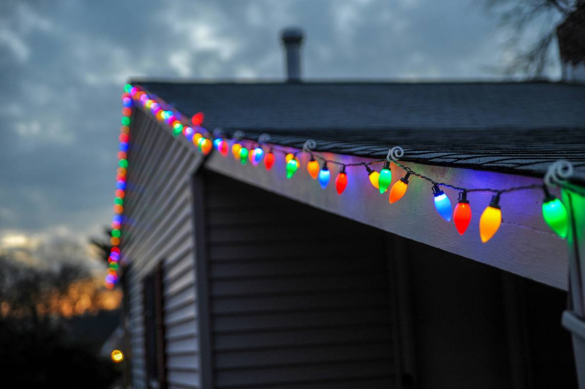 Before: flickering, sparse C9 bulbs on roof edge. After: uniform, bright LED C9 roof line glowing evenly along entire eave